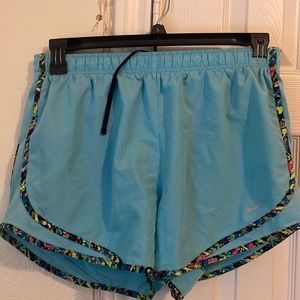 Large drifit Nike shorts. Blue with multi color seam